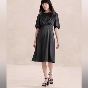 Flutter Sleeve black knee length dress. New with tags size 12 womens